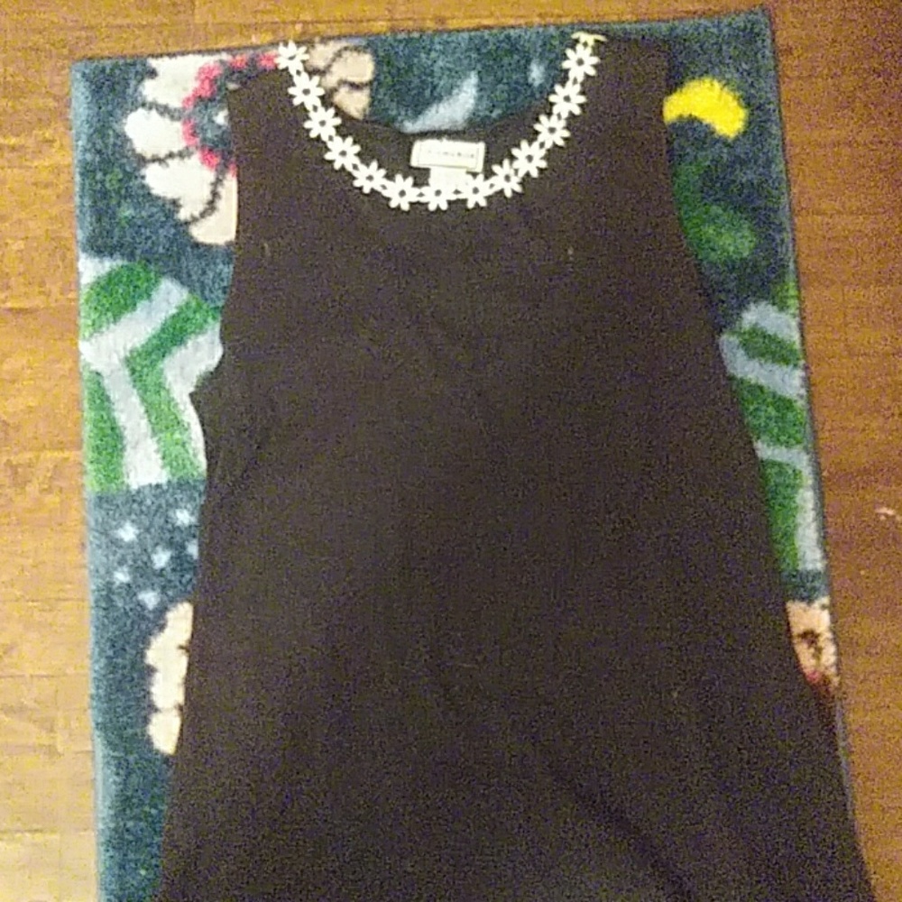 A dark blue dress with flower lace on the neck lin